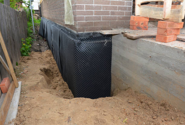 Happy homeowners after waterproofing job in Flemington